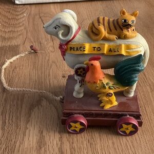 Peace to All Figurine featuring ram, tiger, rooster